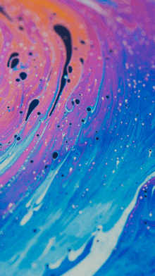 a close up of a colorful painting with bubbles