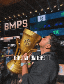 a man is kissing a trophy that says respect my team respect it