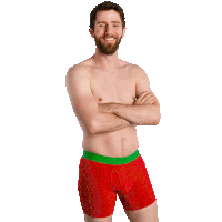 a shirtless man wearing red boxer shorts with a green band