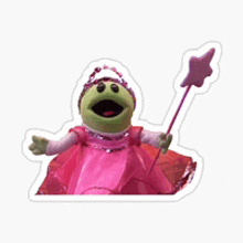 a frog wearing a pink dress and holding a wand .