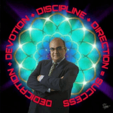 a man in a suit and tie stands in front of a circle that says discipline direction devotion success