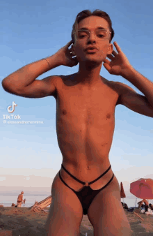 a tiktok video of a shirtless man in a bikini