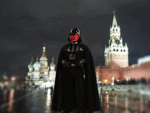 a person dressed as darth vader in front of a castle