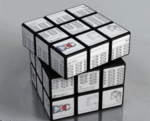 a black and white rubik 's cube with the letters dcc on it