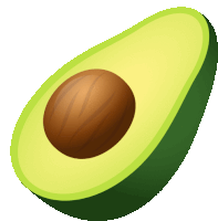 a green avocado with a brown seed in it