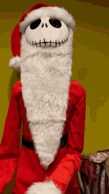 a person dressed in a santa costume with a white beard