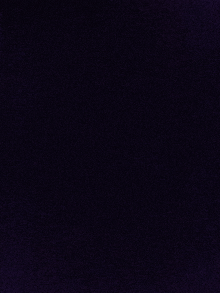 a close up of a dark purple background with a texture