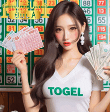 a woman wearing a white shirt with the word togel on it