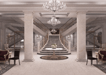 a large staircase with a chandelier hanging above it