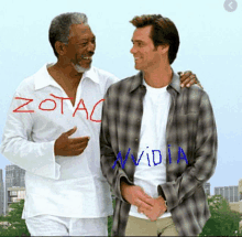 two men are standing next to each other with the word zotac written on one of the men 's shirts