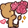 a teddy bear is holding a bouquet of pink roses in its paws .