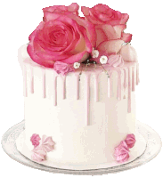 a white cake with pink frosting and pink flowers on top