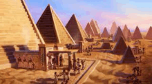 a group of people are standing in front of a row of pyramids .