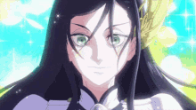 a girl with long black hair and green eyes is wearing a crown .