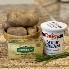 a container of daisy sour cream sits next to a block of kerrygold pure irish butter