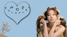 a woman with pigtails and a heart that says pop play on it