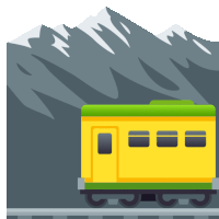 a yellow train with a green top is going down a track with mountains in the background