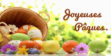 a basket full of easter eggs and flowers with the words joyeuses paques written above it