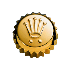 a gold bottle cap with a crown on top of it