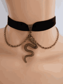 a choker with a snake pendant on it