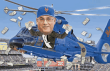 a man in a mets hat is flying in a helicopter with money falling around him