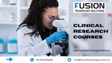 a woman in a lab coat looking through a microscope with the words fusion technology solutions behind her