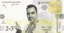 a man is giving a thumbs up on a banknote .