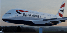 a british airways airplane is flying in the air