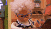 a cartoon character with glasses and a pearl necklace is playing a piano