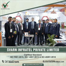 a group of men standing in front of a sign that says ' svart infratel private limited ' on it