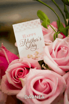 a bouquet of pink roses with a happy mother 's day card