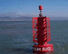 a red buoy with the words yeah buoy on it