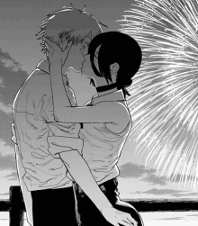 a black and white drawing of a man and a woman kissing in front of fireworks