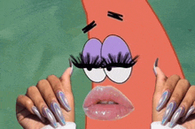 a woman with long nails is holding a spongebob squarepants character