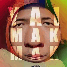 a close up of a man 's face with the words a mak mak written on it .