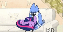 a cartoon bird is sitting on top of a couch holding a baby .