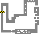 a black and white drawing of a maze with a yellow checkered item in the middle .