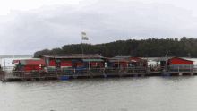 a row of houses on a raft in the water