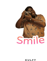 a man is smiling while holding a camera and the word smile is behind him