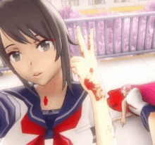 a girl in a sailor suit is taking a selfie with her bloody hand .