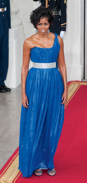 Image may contain Clothing Apparel Fashion Gown Evening Dress Robe Dress Human Person and Michelle Obama