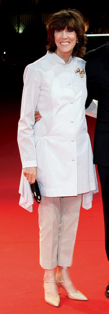 Image may contain Nora Ephron Clothing Apparel Coat Lab Coat Human Person Sleeve and Long Sleeve