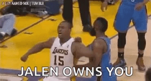 a basketball player is hugging another player on the court while another player says `` jalen owns you '' .