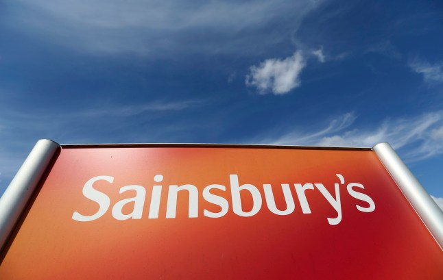 A Sainsbury's logo sits on a sign outside a goods distribution centre, operated by J Sainbury Plc, in Dartford, U.K., on Monday, July 7, 2014. Sainsbury said last month that it expects same-store sales growth to resume later this year after nine years of unbroken growth was ended with two quarters of decline. Photographer: Chris Ratcliffe/Bloomberg via Getty Images