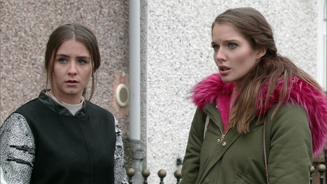 Sophie and Rosie Webster stood outside a house in Coronation Street