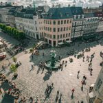 Birds eye view of a town in Denmark with pedestrians crossing the road.