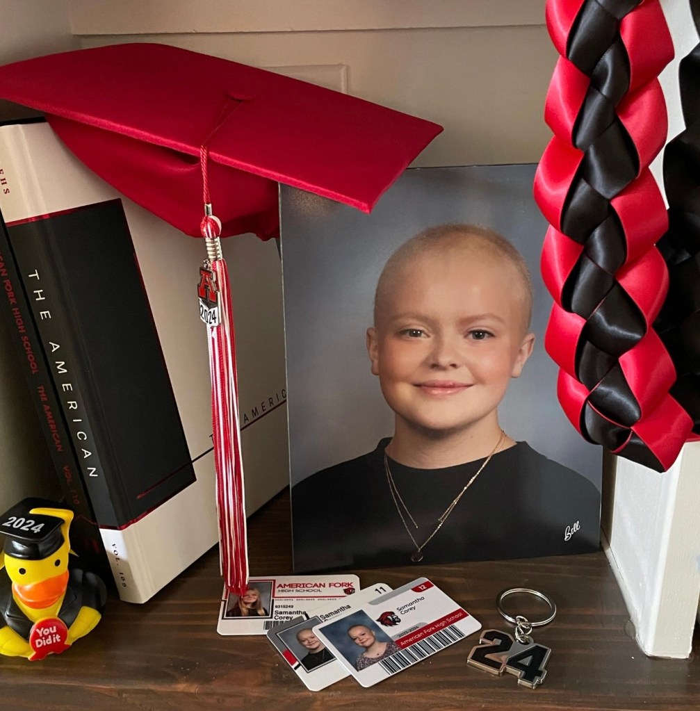 Photo of Mantha near a graduation cap.