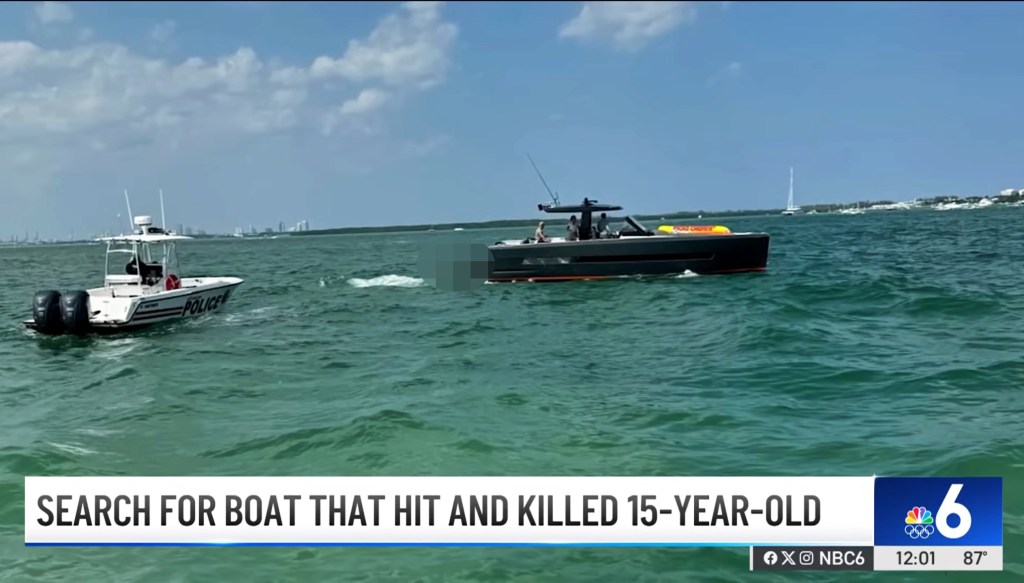 Police boat responds to another boat in ocean