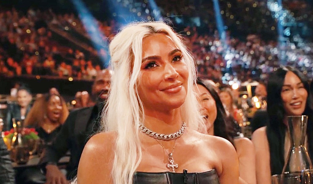 Kim Kardashian smirking. 