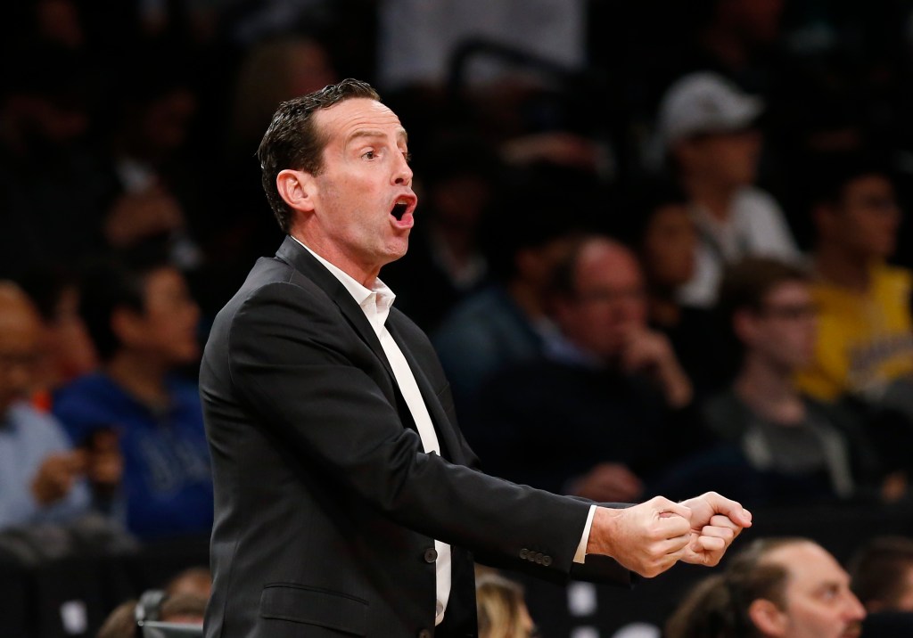 Brooklyn Nets head coach Kenny Atkinson, in a suit, speaking during the first half of a game against the Boston Celtics at the Barclays Center